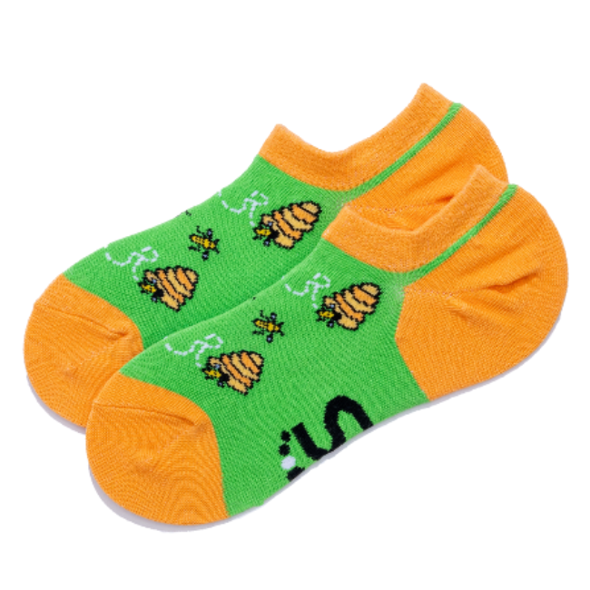 A pair of low-cut ankle socks with bright green sides featuring bees and hives, and orange toes, heels, and cuffs.