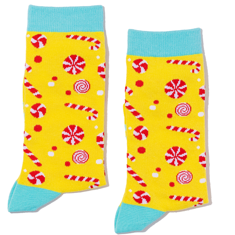 Pair of socks with candy cane and lollipop pattern on a yellow background