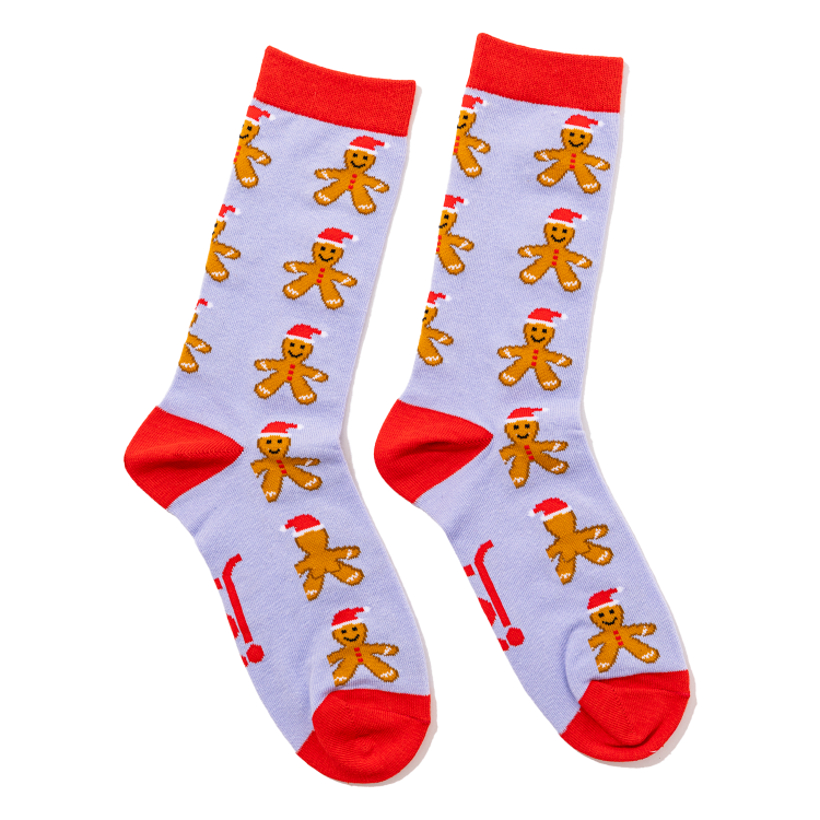 Pair of socks with gingerbread man pattern on a light grey/purple background