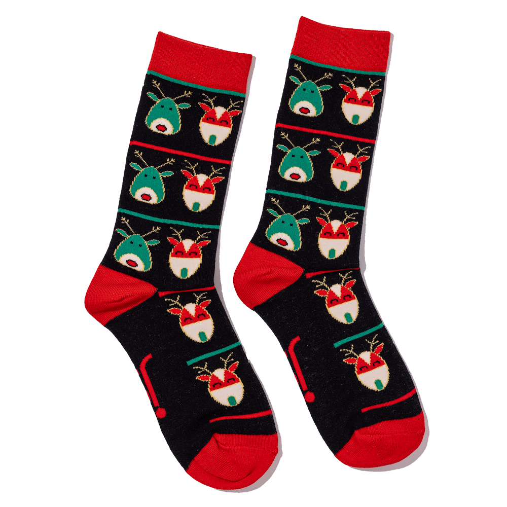 Pair of socks with reindeer pattern on a black background