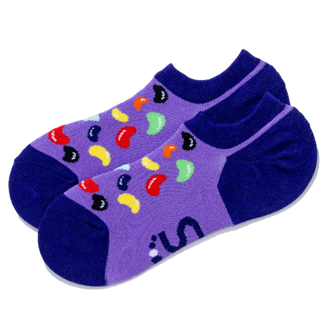 A pair of low-cut ankle socks in purple and featuring jellybean pattern
